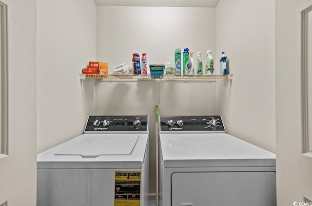 laundry area with washing machine and clothes dryer and laundry area