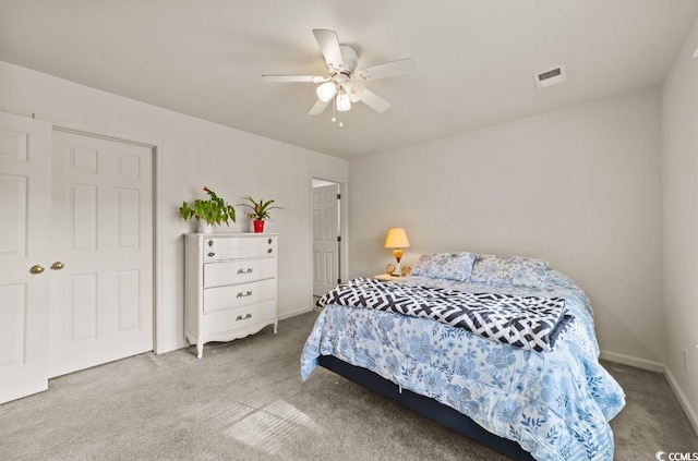 bedroom with carpet, baseboards, ceiling fan, and visible vents