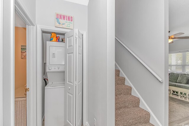 6001-310 S Kings Hwy, Myrtle Beach, SC 29575 - staircase featuring stacked washing machine and dryer, ceiling fan, and carpet floors