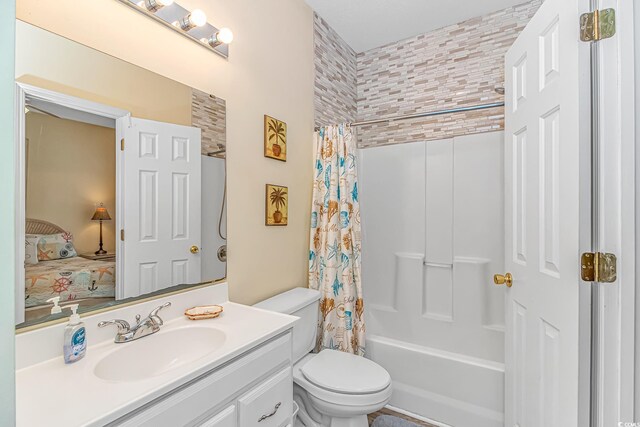 6001-310 S Kings Hwy, Myrtle Beach, SC 29575 - ensuite bathroom with toilet, vanity, and shower / tub combo with curtain