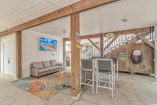 6001-310 S Kings Hwy, Myrtle Beach, SC 29575 - view of patio / terrace with an outdoor living space, stairway, outdoor dining space, and grilling area