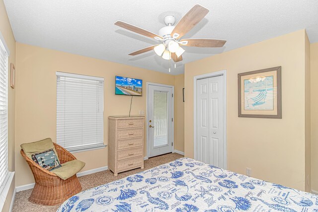 6001-310 S Kings Hwy, Myrtle Beach, SC 29575 - bedroom with a ceiling fan, carpet, baseboards, a closet, and a textured ceiling
