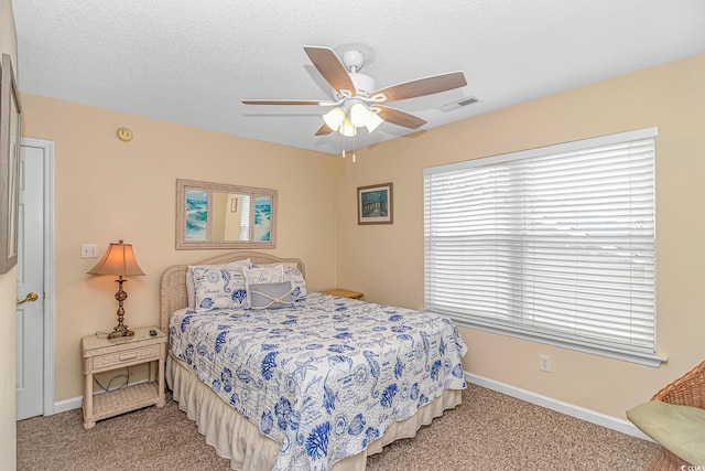 6001-310 S Kings Hwy, Myrtle Beach, SC 29575 - carpeted bedroom featuring baseboards, a ceiling fan, and a textured ceiling