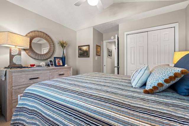 bedroom featuring lofted ceiling, a closet, and a ceiling fan