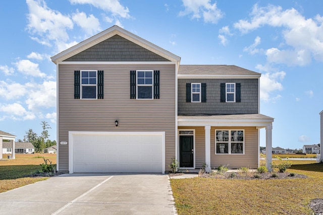 2639 Riverboat Way, Conway, SC 29526 - view of front facade with concrete driveway, a garage, and a front lawn