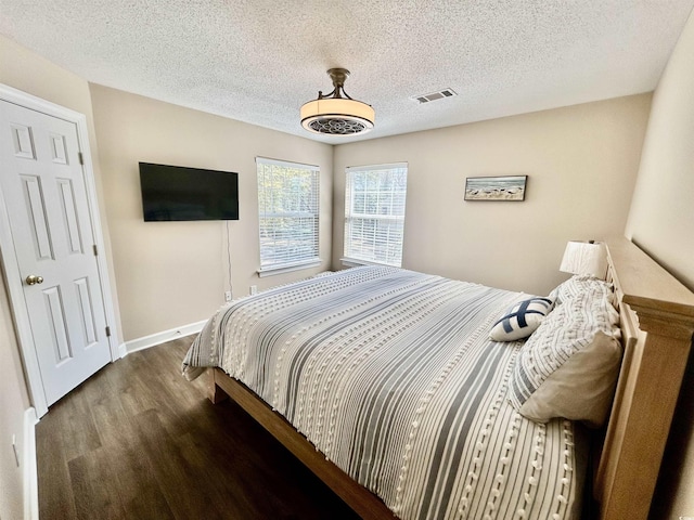 4370 Crepe Myrtle Ct Unit F, Murrells Inlet, SC 29576 - bedroom with wood finished floors and a textured ceiling