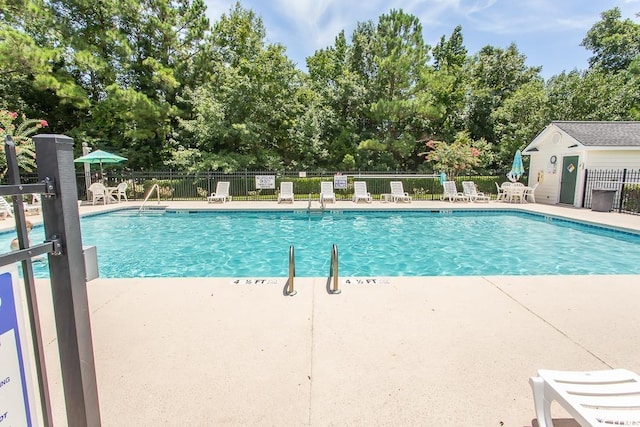 4370 Crepe Myrtle Ct Unit F, Murrells Inlet, SC 29576 - community pool with fence, view of wooded area, and a patio area