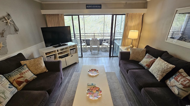 415 Ocean Creek Dr Unit 2443, Myrtle Beach, SC 29572 - living area featuring healthy amount of natural light, dark wood-style floors, wainscoting, and ornamental molding