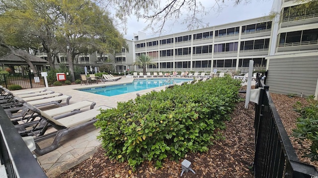 415 Ocean Creek Dr Unit 2443, Myrtle Beach, SC 29572 - community pool featuring a patio area and fence