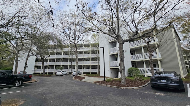 415 Ocean Creek Dr Unit 2443, Myrtle Beach, SC 29572 - view of apartment building / complex with uncovered parking