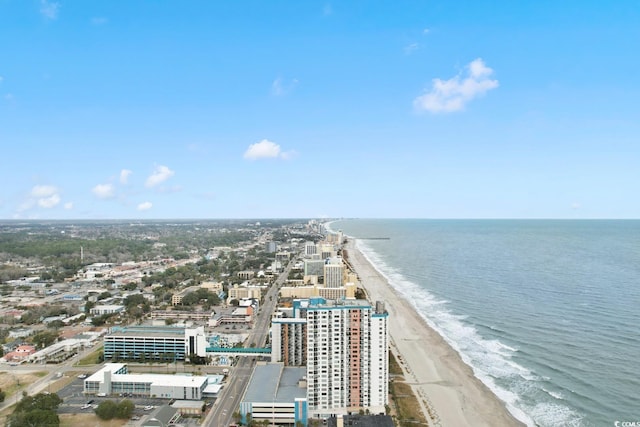 birds eye view of property with a beach view and a water view