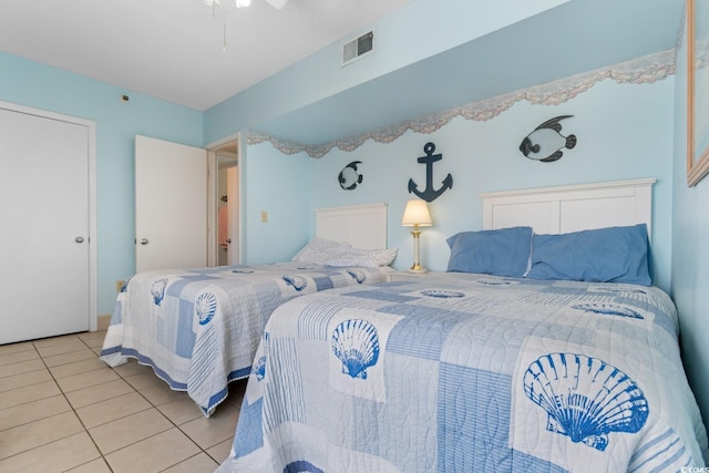 bedroom with light tile patterned flooring and visible vents