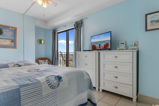 bedroom with access to outside and light tile patterned floors