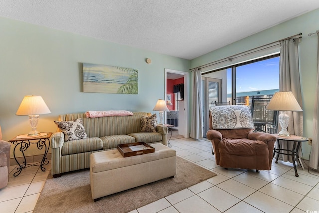 tiled living room featuring a textured ceiling