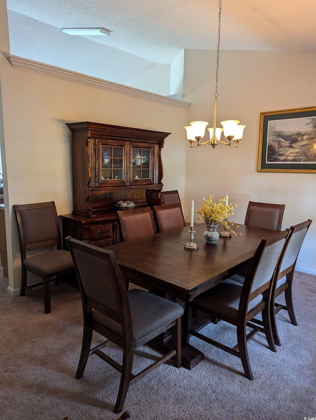 carpeted dining room with vaulted ceiling, a chandelier, and a textured ceiling