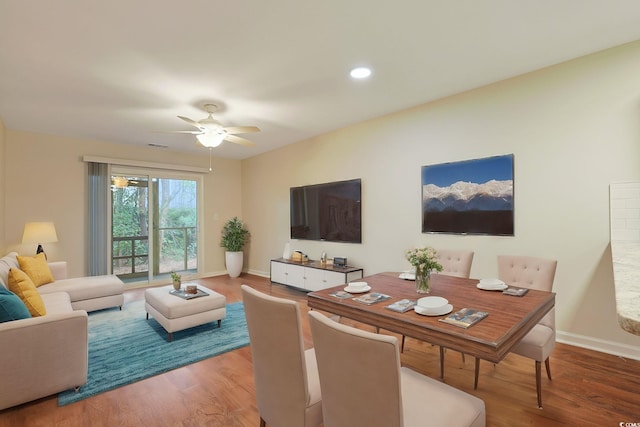 living area featuring a ceiling fan, wood finished floors, baseboards, and recessed lighting