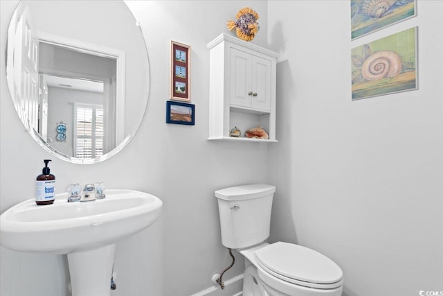 6095 Catalina Dr Unit 1112, North Myrtle Beach, SC 29582 - half bathroom featuring baseboards and toilet