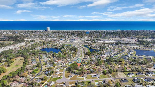birds eye view of property featuring a residential view and a water view