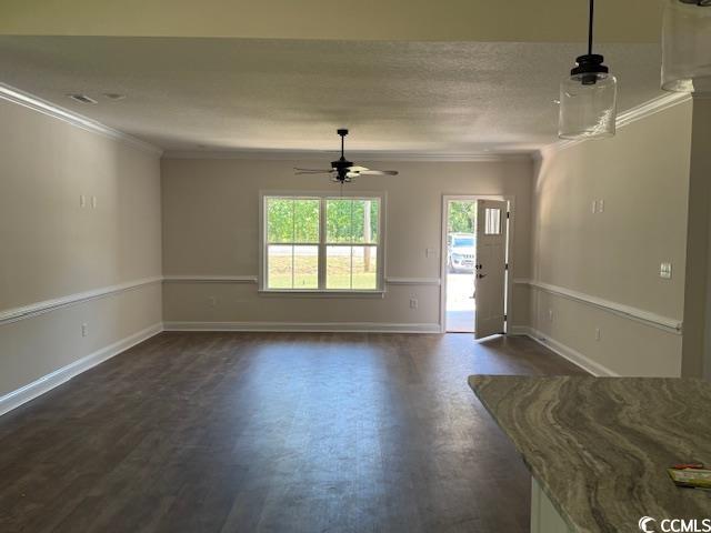 1397 Knotty Branch Rd, Conway, SC 29527 - unfurnished living room featuring ornamental molding, a ceiling fan, baseboards, and dark wood finished floors
