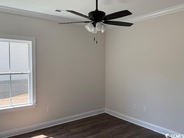 1397 Knotty Branch Rd, Conway, SC 29527 - spare room featuring crown molding, baseboards, dark wood finished floors, and a ceiling fan