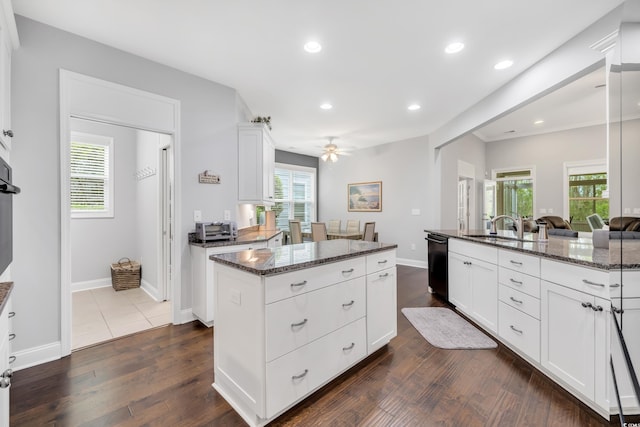 1478 Suncrest Dr, Myrtle Beach, SC 29577 - kitchen with a kitchen island, dark stone counters, dark wood-style floors, recessed lighting, and dishwasher