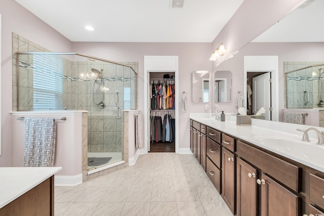1478 Suncrest Dr, Myrtle Beach, SC 29577 - bathroom with double vanity, a shower stall, baseboards, and a walk in closet