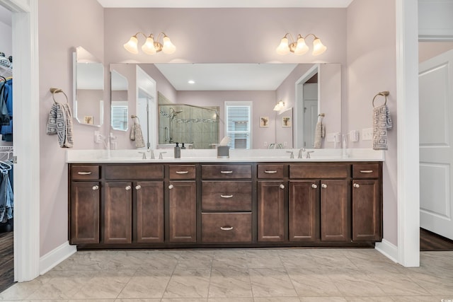 1478 Suncrest Dr, Myrtle Beach, SC 29577 - bathroom with a spacious closet, marble finish flooring, a shower stall, and double vanity