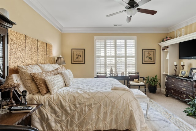 bedroom with carpet floors, ceiling fan, visible vents, and ornamental molding