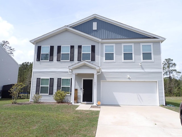 447 Archer Ct, Conway, SC 29526 - view of front of property featuring driveway, a front lawn, a trampoline, and a garage