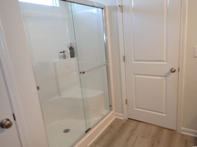 447 Archer Ct, Conway, SC 29526 - bathroom featuring a stall shower and wood finished floors