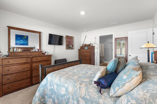 carpeted bedroom with connected bathroom