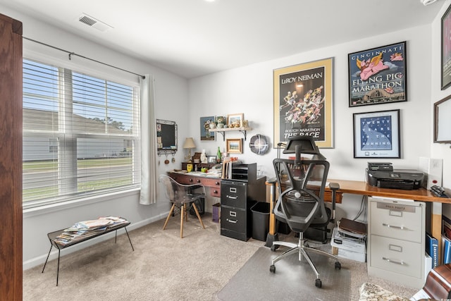 home office featuring visible vents, baseboards, and carpet