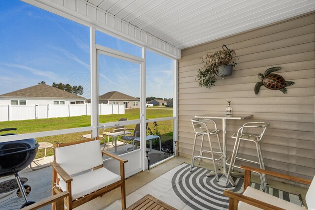 sunroom / solarium with a residential view