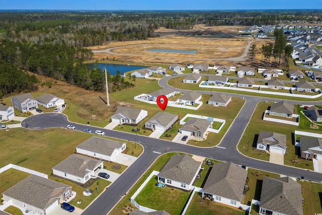 aerial view featuring a residential view and a water view