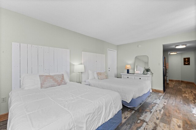 9550 Shore Dr Unit 1518, Myrtle Beach, SC 29572 - bedroom featuring hardwood / wood-style flooring and baseboards