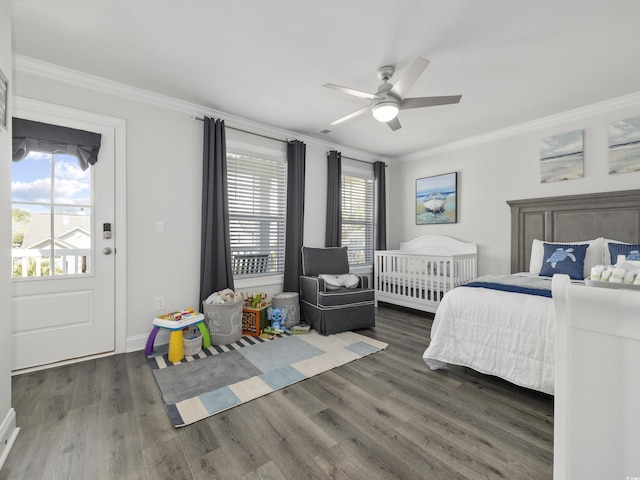 bedroom featuring crown molding, baseboards, ceiling fan, and wood finished floors