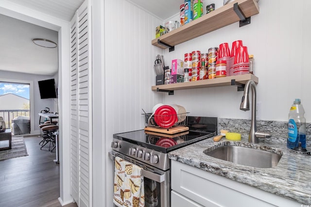 210 75th Ave N Unit 4030, Myrtle Beach, SC 29572 - kitchen featuring electric range, open shelves, a sink, light stone counters, and wood finished floors