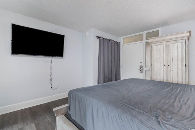 210 75th Ave N Unit 4030, Myrtle Beach, SC 29572 - bedroom featuring wood finished floors, baseboards, and a textured ceiling