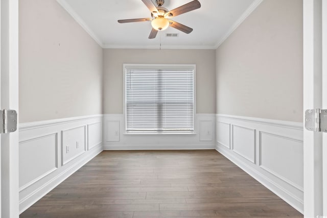 5885 Ledro Ln, Myrtle Beach, SC 29572 - empty room with ceiling fan, ornamental molding, a wainscoted wall, and wood finished floors