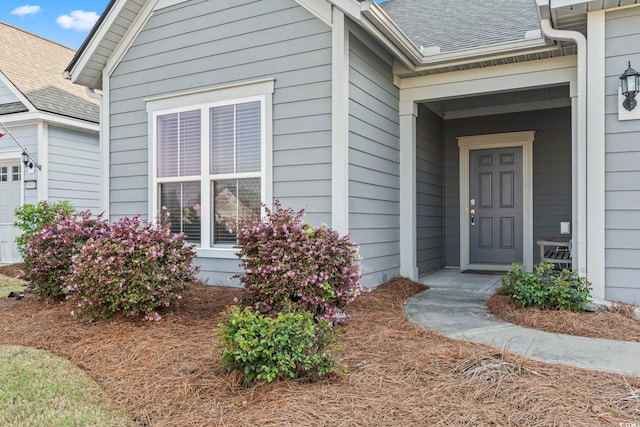 5885 Ledro Ln, Myrtle Beach, SC 29572 - property entrance with a shingled roof and an attached garage