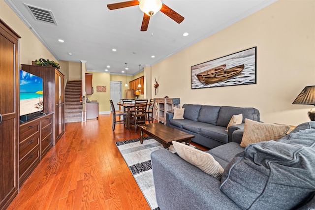 2790 Howard Ave Unit D, Myrtle Beach, SC 29577 - living area featuring ornamental molding, stairs, a ceiling fan, light wood-style floors, and recessed lighting