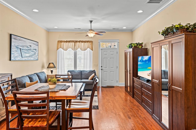 2790 Howard Ave Unit D, Myrtle Beach, SC 29577 - dining area featuring wood finished floors, crown molding, a ceiling fan, and recessed lighting