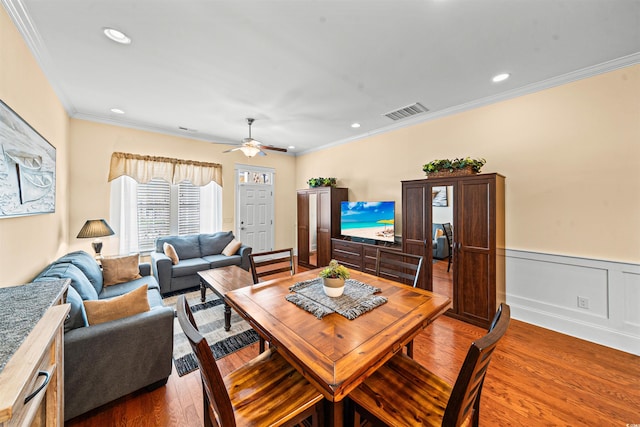 2790 Howard Ave Unit D, Myrtle Beach, SC 29577 - dining room with light wood finished floors, crown molding, ceiling fan, wainscoting, and recessed lighting