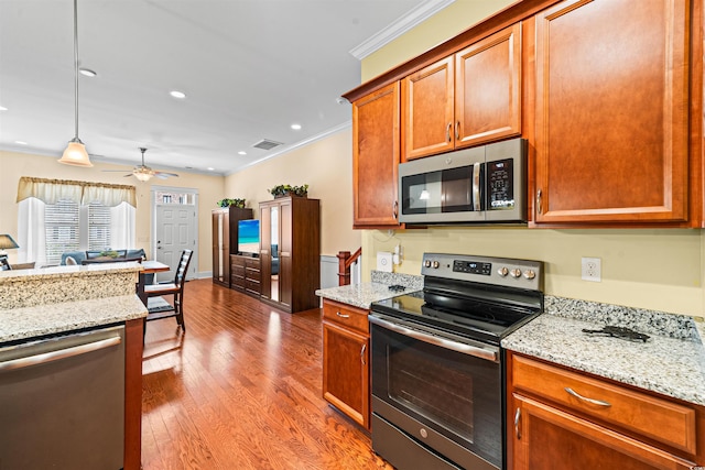 2790 Howard Ave Unit D, Myrtle Beach, SC 29577 - kitchen featuring stainless steel appliances, ornamental molding, wood finished floors, ceiling fan, and light stone counters