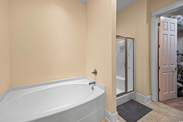 2790 Howard Ave Unit D, Myrtle Beach, SC 29577 - full bath with a garden tub, a shower stall, tile patterned flooring, and a spacious closet