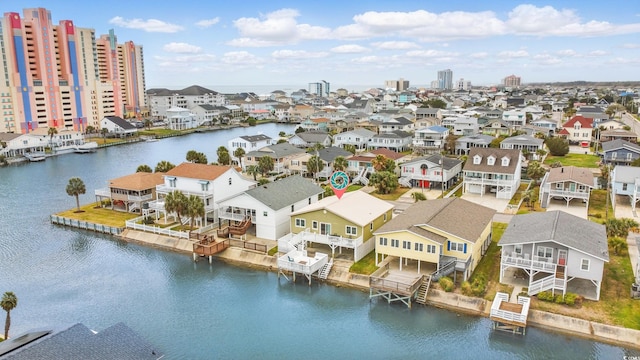 birds eye view of property with a residential view and a water view