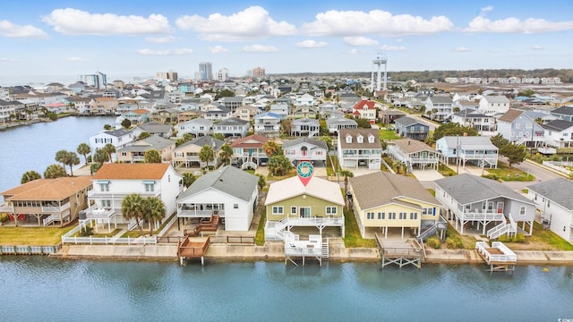 drone / aerial view featuring a residential view and a water view