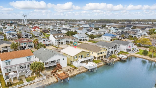 bird's eye view with a water view and a residential view