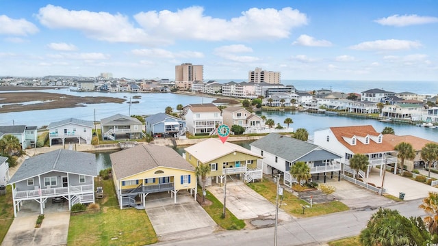 bird's eye view featuring a residential view and a water view