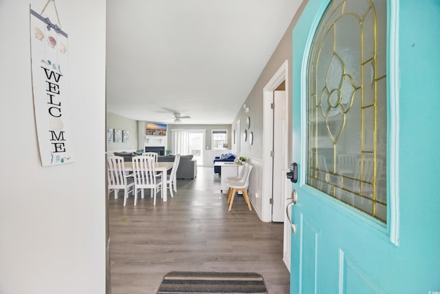 entryway featuring wood finished floors and a ceiling fan